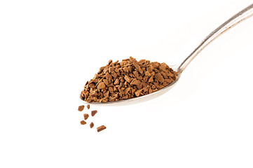 Instant coffee in spoon isolated on white background.