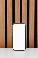 Phone, Tablet and Notebook against wood slat wall