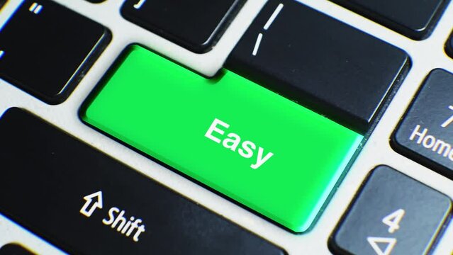 Laptop Keyboard Close Up and Finger Press Easy Nomad Word or Text Button Key