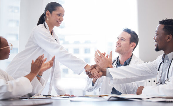 Doctors, Staff And Meeting With Handshake, Applause Or Promotion With Healthcare Innovation, Growth Or Opportunity. Group, Team Or Coworkers Brainstorming, Clapping Or Shaking Hands With Medical Cure