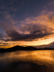 After the rain sunrise waterscape with clouds
