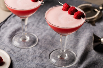 Alcoholic Clover Club cocktail pink gin, dry vermouth, raspberry sugar syrup, fresh lemon juice, fresh lime juice and egg white