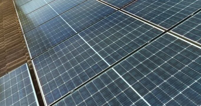 Sunlight activating rooftop PV cells, uses solar radiation to produce electricity