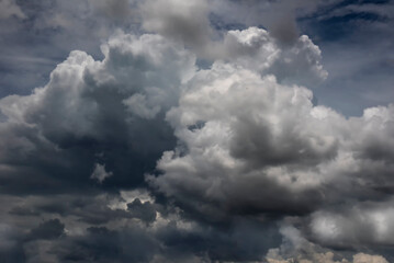 Dramatic dark storm thundercloud rain clouds on black sky background. Dark thunderstorm clouds rainny landscape. Meteorology danger windstorm disaster climate. Dark cloudscape storm disaster gray sky