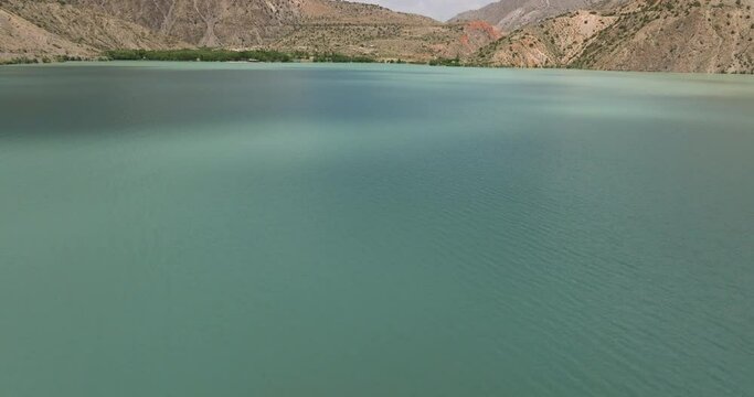 Iskanderkul Lake With Tranquil Waters In Tajikistan - aerial shot