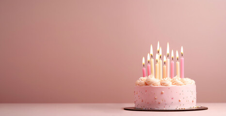 Yummy birthday cake with candles on pastel pink background. Party birthday concept. 