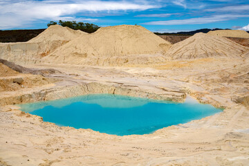 Fototapeta na wymiar Kaolin extraction mine - White mud, clay and volcanic ash