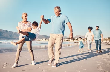 Papier Peint photo Vielles portes Swinging, grandparents and a child walking on the beach on a family vacation, holiday or adventure in summer. Young boy kid holding hands with a senior man and woman outdoor with fun energy or game
