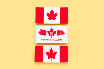 Card with text HAPPY CANADA DAY, date 1 JULY 1867 and flags on yellow background