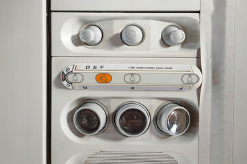 light switch and air conditioning on an airplane