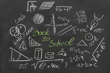 Different drawn geometric figures, math formulas and text BACK TO SCHOOL on black chalkboard - obrazy, fototapety, plakaty