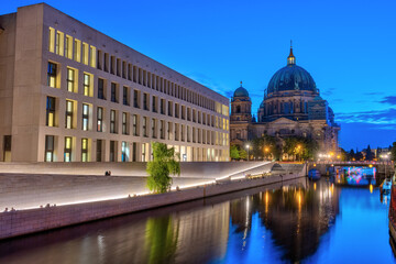 Fototapeta premium The modern backside of the City Palace, the cathedral and the river Spree in Berlin at night
