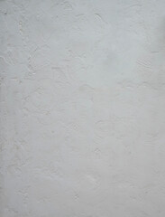 A cement wall with random brush strokes creates outstanding pattern on surface.  Background, textures, object, decoration, design, building, construction.