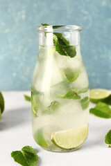 Bottle of cold mojito on light table