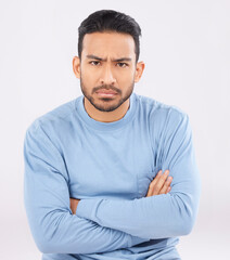 Portrait, angry and man with arms crossed, frustrated and upset guy against a white studio...