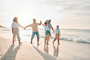 Holding hands, big family and swing at the beach walking with freedom, travel and bonding at...
