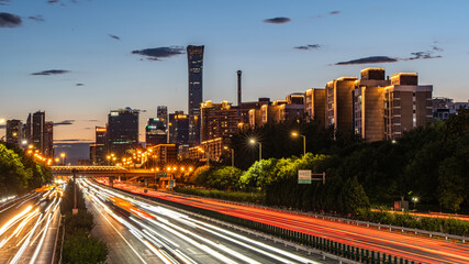 Looking at the Guomao CBD buildings from the sky bridge in the evening