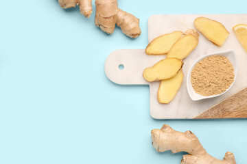 Fresh ginger roots and bowl with dried powder on blue background