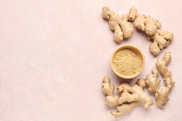 Fresh ginger roots and wooden bowl with dried powder on pink background