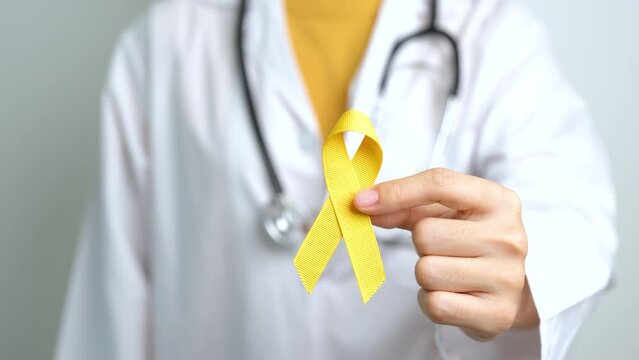 Yellow September, Suicide prevention day, Childhood, Sarcoma, bone and bladder cancer Awareness month, Yellow Ribbon for supporting people life and illness. Healthcare and World cancer day concept