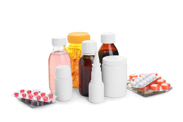 Different pills and bottles of medicines on white background