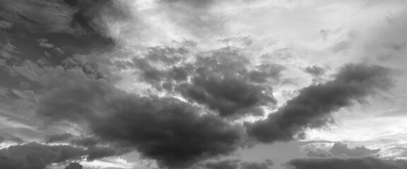 Gllomy sky with dark gray clouds, sky with storm clouds dark, The dark sky with heavy clouds converging and a violent storm before the rain, bad or moody weather sky. 