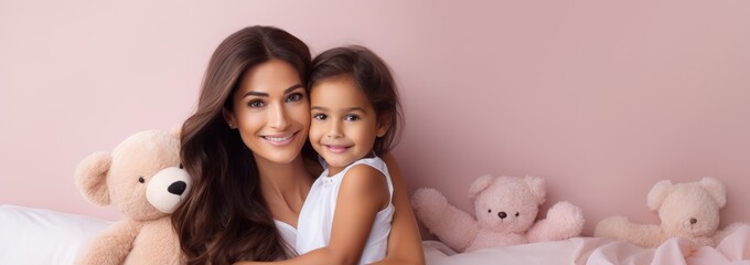 Portrait of a Indian girl and mother on pink rose gold background. World Mother's Day concept - obrazy, fototapety, plakaty