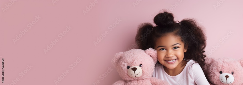 Wall mural Portrait of African American girl playing with toy bear doll