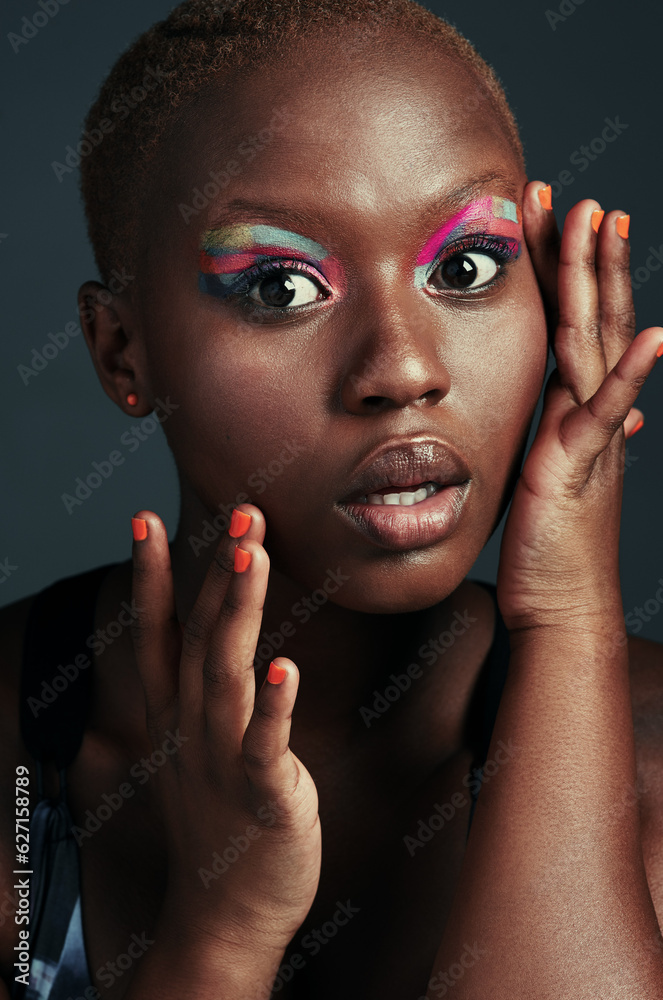 Canvas Prints Youre always on fleek if youre wearing color. Cropped shot of a beautiful woman wearing colorful eyeshadow while posing against a grey background.