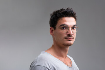 Short-sleeved shirt, chest tattoo visible