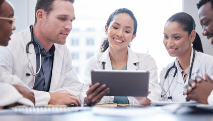 Healthcare, tablet and collaboration with a team of doctors in the hospital boardroom for a...
