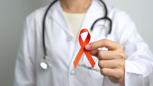 Orange Ribbon for Leukemia, Kidney cancer day, world Multiple Sclerosis, CRPS, Self Injury Awareness month. Healthcare and word cancer day concept
