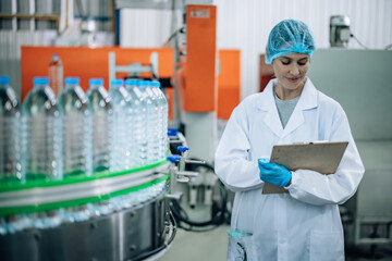 Inspector check conveyor operation with precise bottled water sequencing for seamless production.