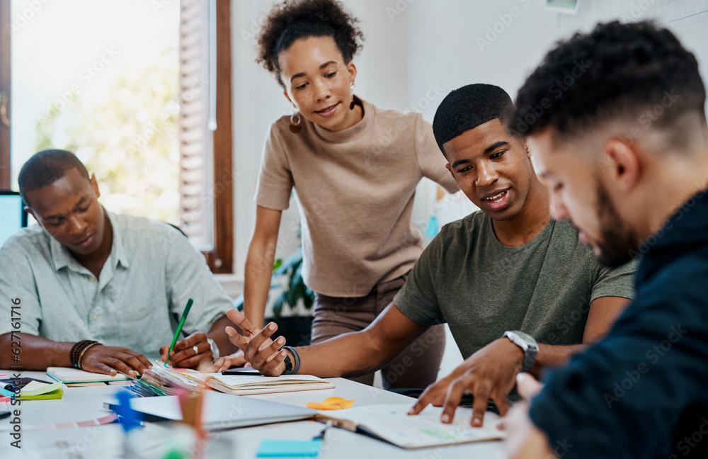 Poster go getters doing what go getters do best. shot of a group of young businesspeople having a meeting i