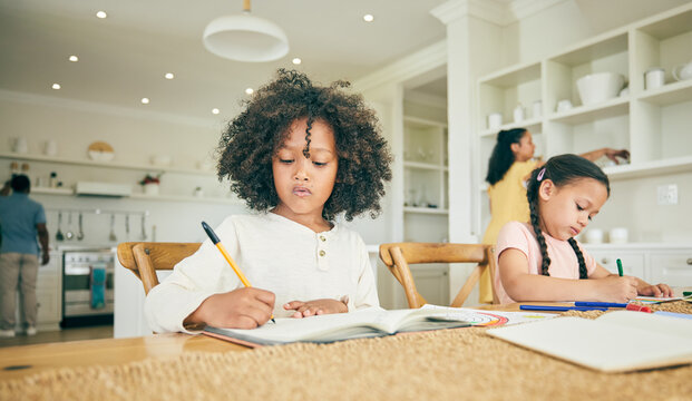 Children, writing and learning with homework in family home with book, pen or focus for development at desk. Young kids together, drawing or thinking for assessment, homeschool and education in house