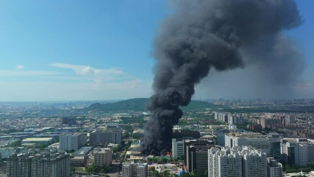 Aerial view of Fire in industrial building at city