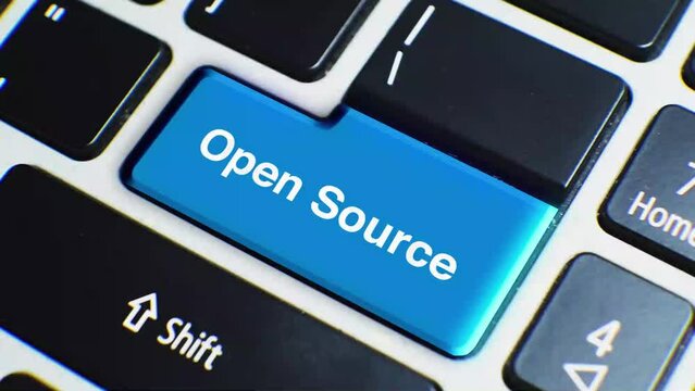 Laptop Keyboard Close Up and Finger Press Open Source Word or Text Button Key