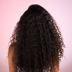 Woman, back and healthy hair in studio for wellness, cosmetics and growth by pink background. Girl,...