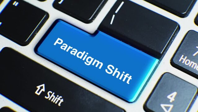Laptop Keyboard Close Up and Finger Press Paradigm Shift Word or Text Button Key