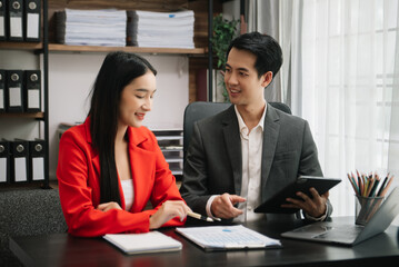  Team work process. Photo young business crew working with new startup project. Project managers meeting. Analyze plans, papers. At office..