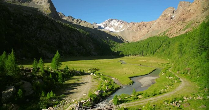 Amazing pristine nature of Predarossa or Preda Rossa mountain destination in summer season in Val Masino, Italy. Aerial ascending