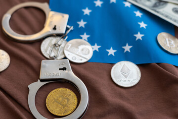 Bitcoins and handcuffs as an abstract symbol of crime that can hide a crypto currency
