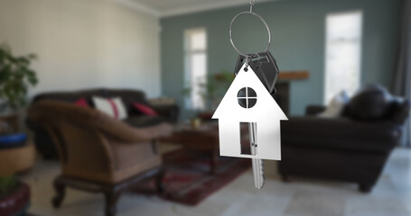Composite of silver house keys over home interior
