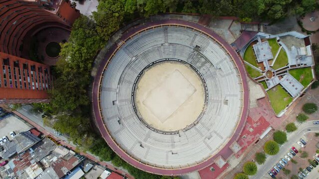 Plaza De Toros De Santamaria Bullring Bogota Colombia. Aerial Drone Top Down View Of Circular Bullring Arena Surrounded By Red Brick Urban Buildings.