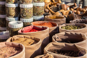 Fototapeta premium Bags of mixed spices and herbal tea in the street market. National cuisine and cooking concept. Bukhara, Uzbekistan