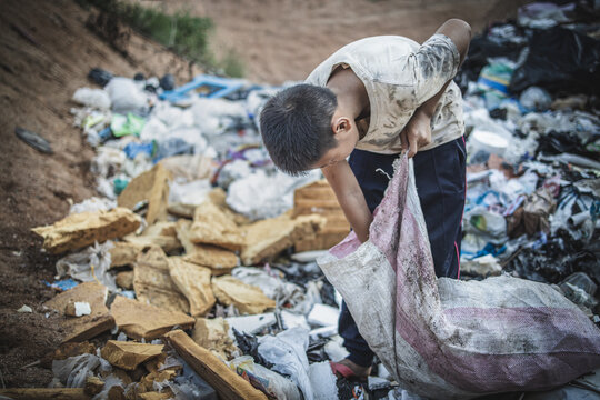 Child labor. Children are forced to work on rubbish. Poor children collect garbage. Poverty, Violence children and trafficking concept,Anti-child labor, Rights Day on December 10.