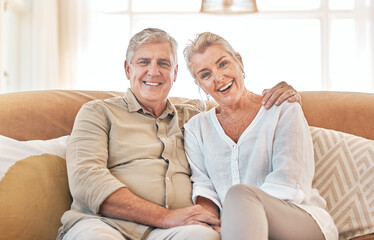 Old couple, hug and portrait, retirement together with love and care in marriage, people on sofa at home. Relax in lounge, life partner and pension, man and woman bonding with trust and commitment