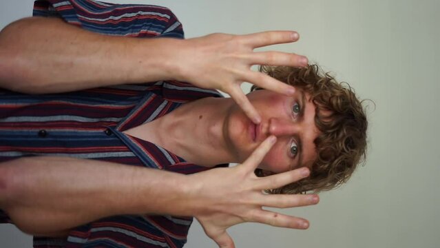 showing nine fingers vertical video