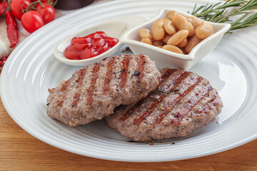 Grilled beef burger cutlet with sauce