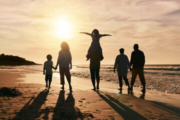 Silhouette, family is walking on beach and back view with ocean waves, sunset and bonding in...